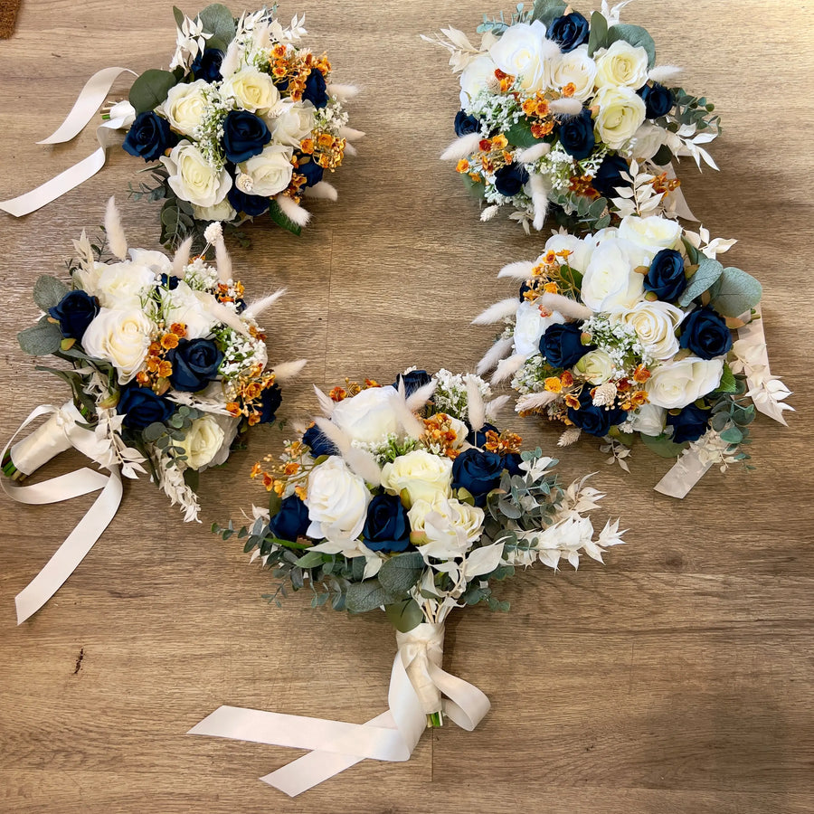 Navy blue and ivory wedding bouquets for a bride and bridesmaids, handmade by Claire De Fleurs