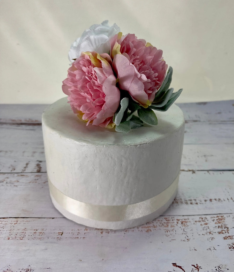 Pink peony cake flowers on a white cake, handmade by Claire De Fleurs